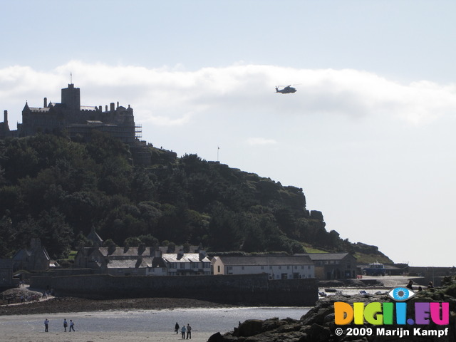 SX09246 Helicopter flying over St Michaels Mount